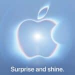 Apple graphic showing its logo with a bright light at the center on a blue-gray background. text: Surprise and shine